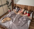 Sick family in protective masks lying in bed