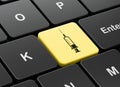 Healthcare concept: Syringe on computer keyboard background