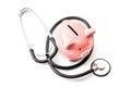 Healthcare cost and the high price of quality health care insurance concept theme with a stethoscope and a pink piggy bank Royalty Free Stock Photo