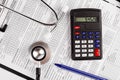 Healthcare costing. Medical phonendoscope, calculator