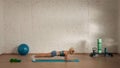 Healthcare creative advertisement concept. Woman fitness coach in the room doing static plank. Royalty Free Stock Photo