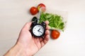 Healthcare or Diet Food advisor show clock for taking care your health with healthy food and concept.