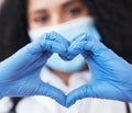 Healthcare, hands and doctor with emoji heart at a hospital for support, hope or thank you for organ or blood donation