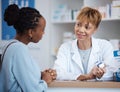 Healthcare, help and black woman with pharmacist at counter for advice on safe medicine and prescription drugs. Health Royalty Free Stock Photo