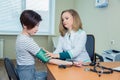 Healthcare, hospital medicine concept - doctor and patient measuring blood pressure