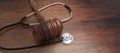 Healthcare Law. Medical stethoscope and judge gavel on lawyer office desk. 3d render