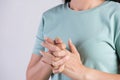 Healthcare and medical concept. Close up woman cracking knuckles Royalty Free Stock Photo