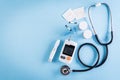 Healthcare and medical concept, Stethoscope and blood glucose meter sets on blue background, World Diabetes day, 14 November