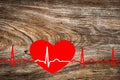 healthcare and medicine concept - close up of red heart with ecg line on wooden background. Happy Valentine day. Hand drawing ECG Royalty Free Stock Photo