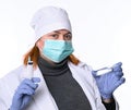 Healthcare and medicine concept. Female doctor in mask  holding syringe and ampoule Royalty Free Stock Photo