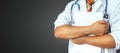 Unrecognizable Male Doctor holds medical documents on grey background. Medicine, health care, insurance concept