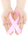 Healthcare and medicine concept - womans hands holding pink breast cancer awareness ribbon, isolated Royalty Free Stock Photo