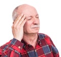 Healthcare, pain, stress and age concept. Sick old man. Senior man suffering from headach over white background