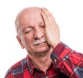 Healthcare, pain, stress and age concept. Sick old man. Senior man suffering from headach over white background