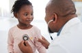 Healthcare, pediatrician and child heart doctor with a patient at hospital, exam on chest with a stethoscope. Black girl Royalty Free Stock Photo