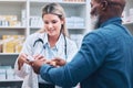 Healthcare, pharmacist and man at counter, medicine, prescription drugs and happy service at drug store. Health Royalty Free Stock Photo