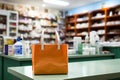 Healthcare products in a drugstore, paper bag on the counter