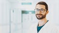 Healthcare, profession, people and medicine concept - smiling male doctor