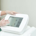 Healthcare professional using medical device with touchscreen display Royalty Free Stock Photo