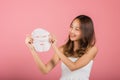 Asian woman holding purifying mask face on hands