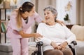 Healthcare, support and caregiver with senior woman for medical help, elderly care and consulting patient. Wheelchair