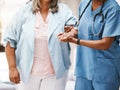 Healthcare, support and nurse with elderly woman for hospital medical help, senior care or patient physiotherapy Royalty Free Stock Photo