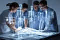 Healthcare Team Collaborating Around Patient Bed with Digital Technology and Data Visualization Royalty Free Stock Photo