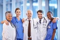 Healthcare, team and portrait of doctors and nurses standing in a corridor of the hospital. Confidence, diversity and Royalty Free Stock Photo