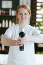 happy massage therapist woman in massage cabinet