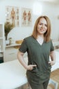 massage therapist woman in massage cabinet looking at camera Royalty Free Stock Photo