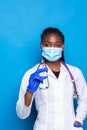 healthcare, vaccination, anesthesia and medical concept - african american female doctor holding syringe with injection isolated Royalty Free Stock Photo