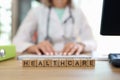 Healthcare word collected with wooden cubes in row