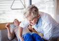 A healthcare worker helping paralysed senior patient in hospital. Royalty Free Stock Photo