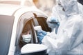 Healthcare worker making coronavirus test at car Royalty Free Stock Photo