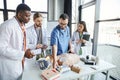 healthcare worker showing defibrillator, CPR manikin Royalty Free Stock Photo