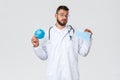 Healthcare workers, medical insurance, pandemic and covid-19 concept. Indecisive male doctor in white coat and glasses