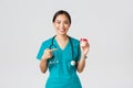 Healthcare workers, preventing virus, quarantine campaign concept. Smiling pretty asian female physician, nurse in Royalty Free Stock Photo