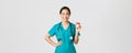 Healthcare workers, preventing virus, quarantine campaign concept. Smiling pretty asian female physician, nurse in Royalty Free Stock Photo