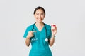 Healthcare workers, preventing virus, quarantine campaign concept. Smiling pretty asian female physician, nurse in Royalty Free Stock Photo