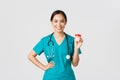 Healthcare workers, preventing virus, quarantine campaign concept. Smiling pretty asian female physician, nurse in Royalty Free Stock Photo