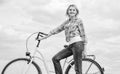 Healthiest most environmentally friendly and most satisfying forms of self transportation. Woman rides bicycle sky