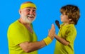 Healthy and active lifestyle. Family time together. Sporting. Grandpa and cute grandson in sportswear. Royalty Free Stock Photo