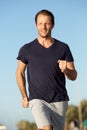 Healthy active man running outside Royalty Free Stock Photo