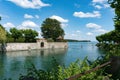 Healthy active outdoor couple enjoys paddleboarding on the canals of Lake Constance on a beautiful summer day