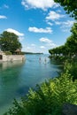 Healthy active outdoor couple enjoys paddleboarding on the canals of Lake Constance on a beautiful summer day