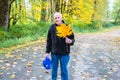 Healthy Active Senior Man Holding a Yellow Big Leaf Maple Leaf Royalty Free Stock Photo