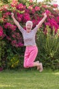 healthy active senior woman jumping Royalty Free Stock Photo