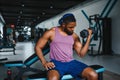 healthy african man working out with dumbbells in gym. Royalty Free Stock Photo