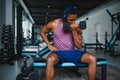 healthy african man working out with dumbbells in gym. Royalty Free Stock Photo