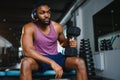 healthy african man working out with dumbbells in gym. Royalty Free Stock Photo